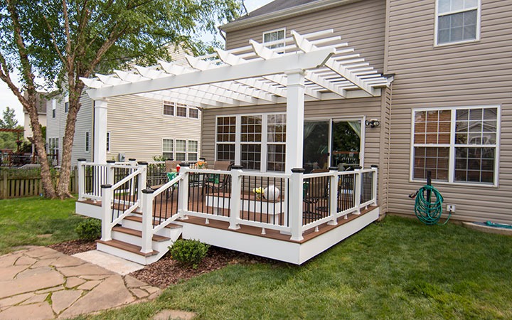 This is an image of a Trex Pergola attached to a home built on top of a deck.