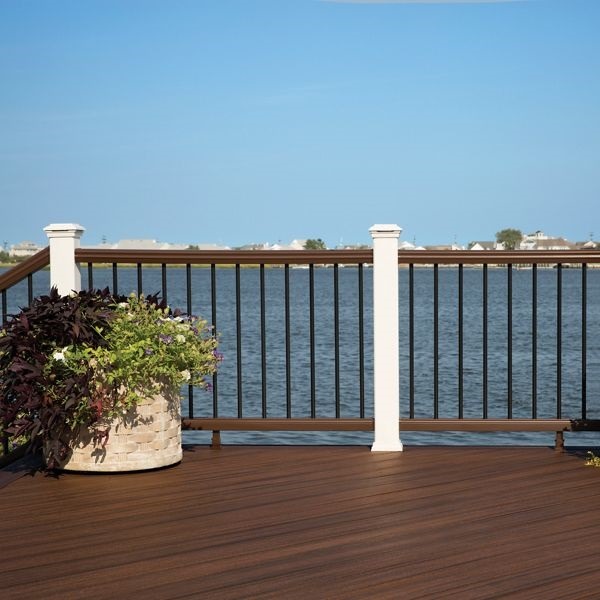 This is a picture of Trex Transcend railing with white posts, with vintage lantern rails, and black aluminum balusters.