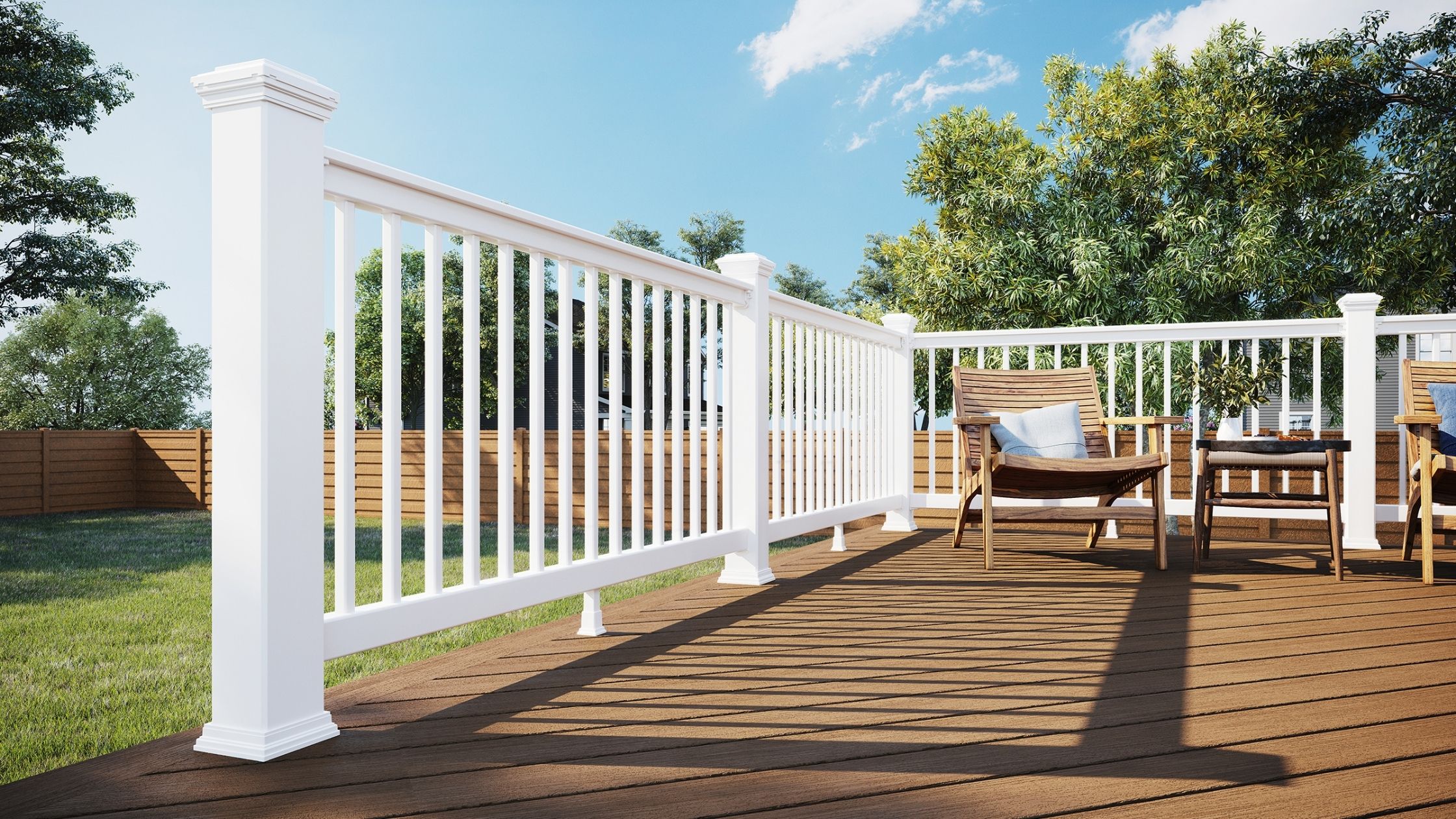 Trex Select railing system in classic white with vertical balusters installed on a wood-tone composite deck.