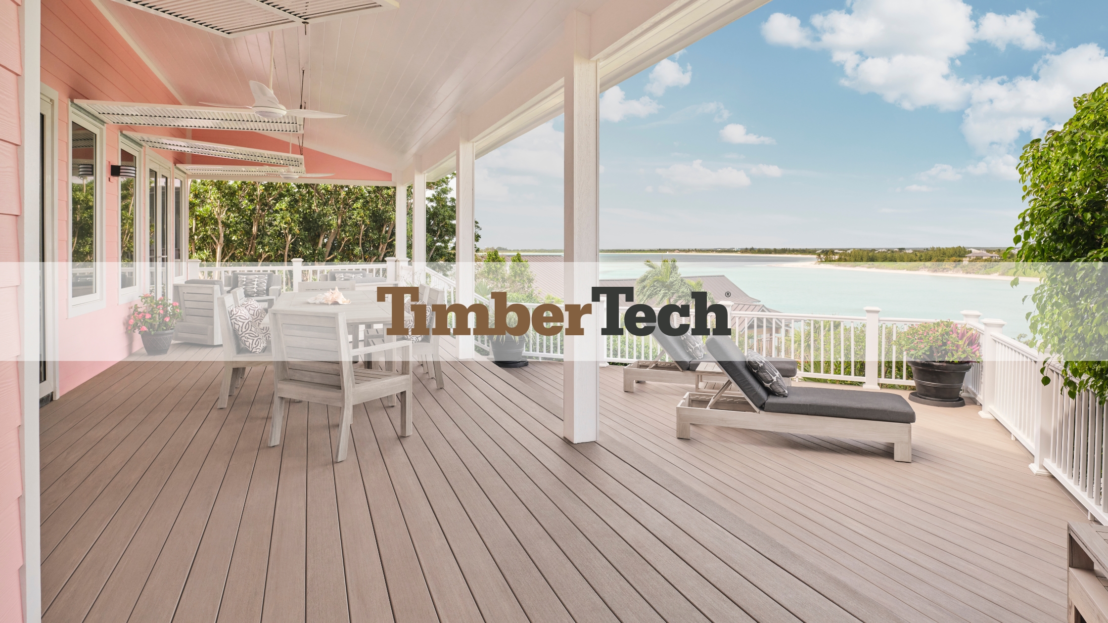 TimberTech composite decking with realistic wood grain finish on a covered coastal deck, showcasing moisture resistance, durability, and premium PVC performance.