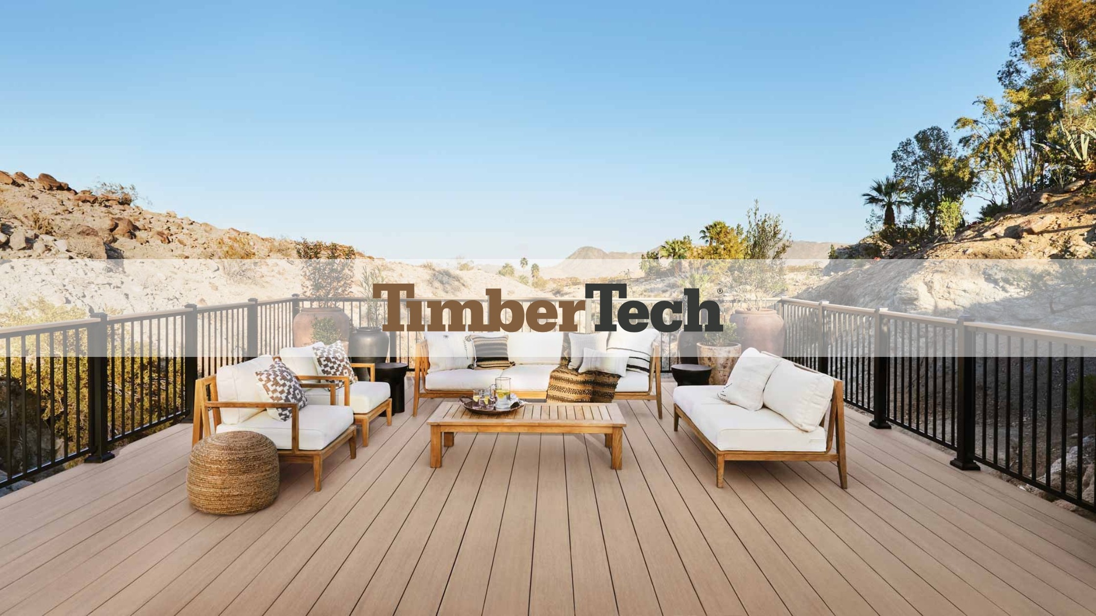 Beautiful TimberTech deck with modern outdoor furniture, showcasing natural wood aesthetics in a scenic desert landscape.