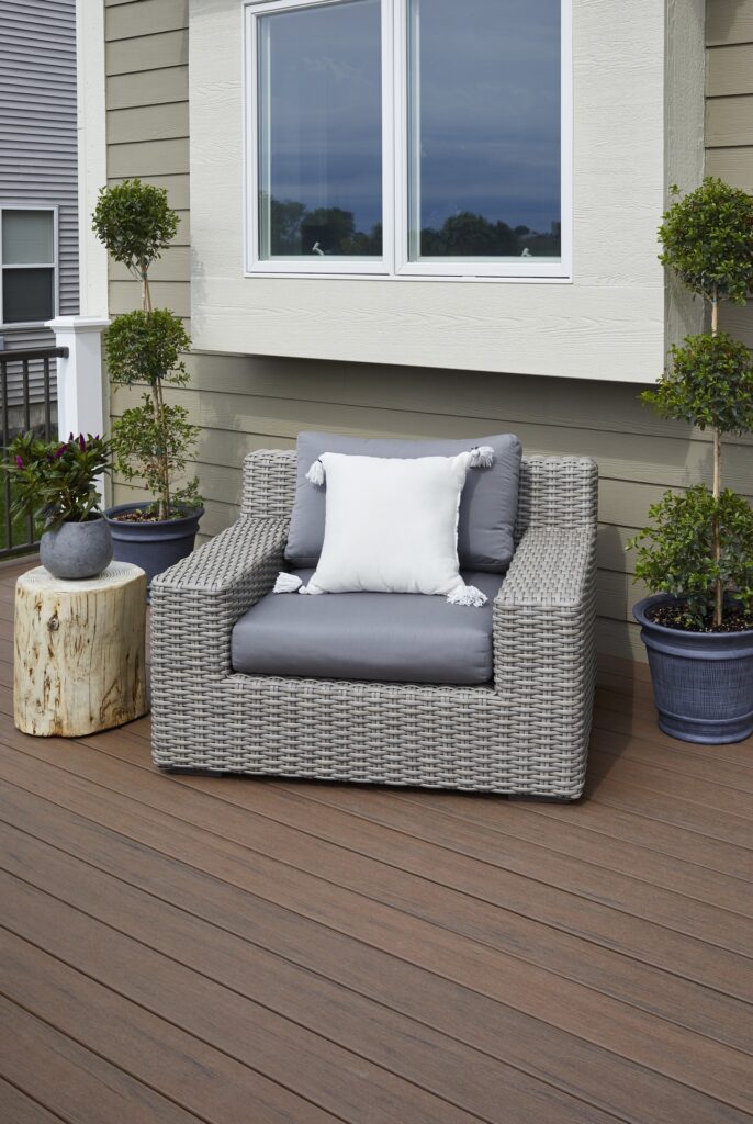 Close-up of TimberTech Reserve Dark Roast composite decking, highlighting rich espresso brown tones and realistic wood grain texture.