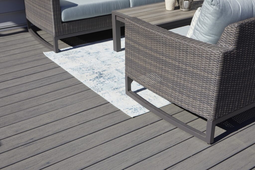 Close-up of TimberTech Reserve Collection - Driftwood composite decking, showcasing its natural gray tones and textured wood grain.