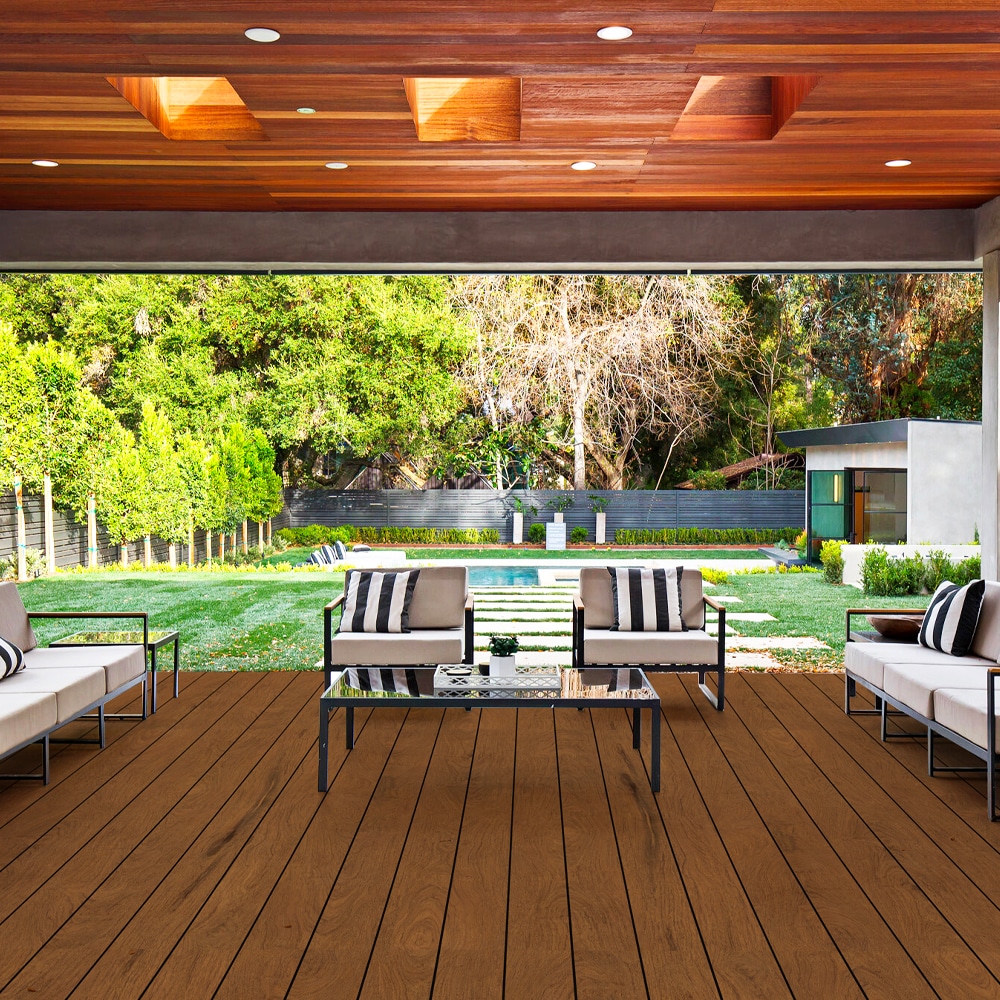 Eva-Last Pioneer Natural Ipe decking elevates this upscale patio setting, featuring bold wood-like texture and deep brown hues that pair beautifully with sleek outdoor furniture.