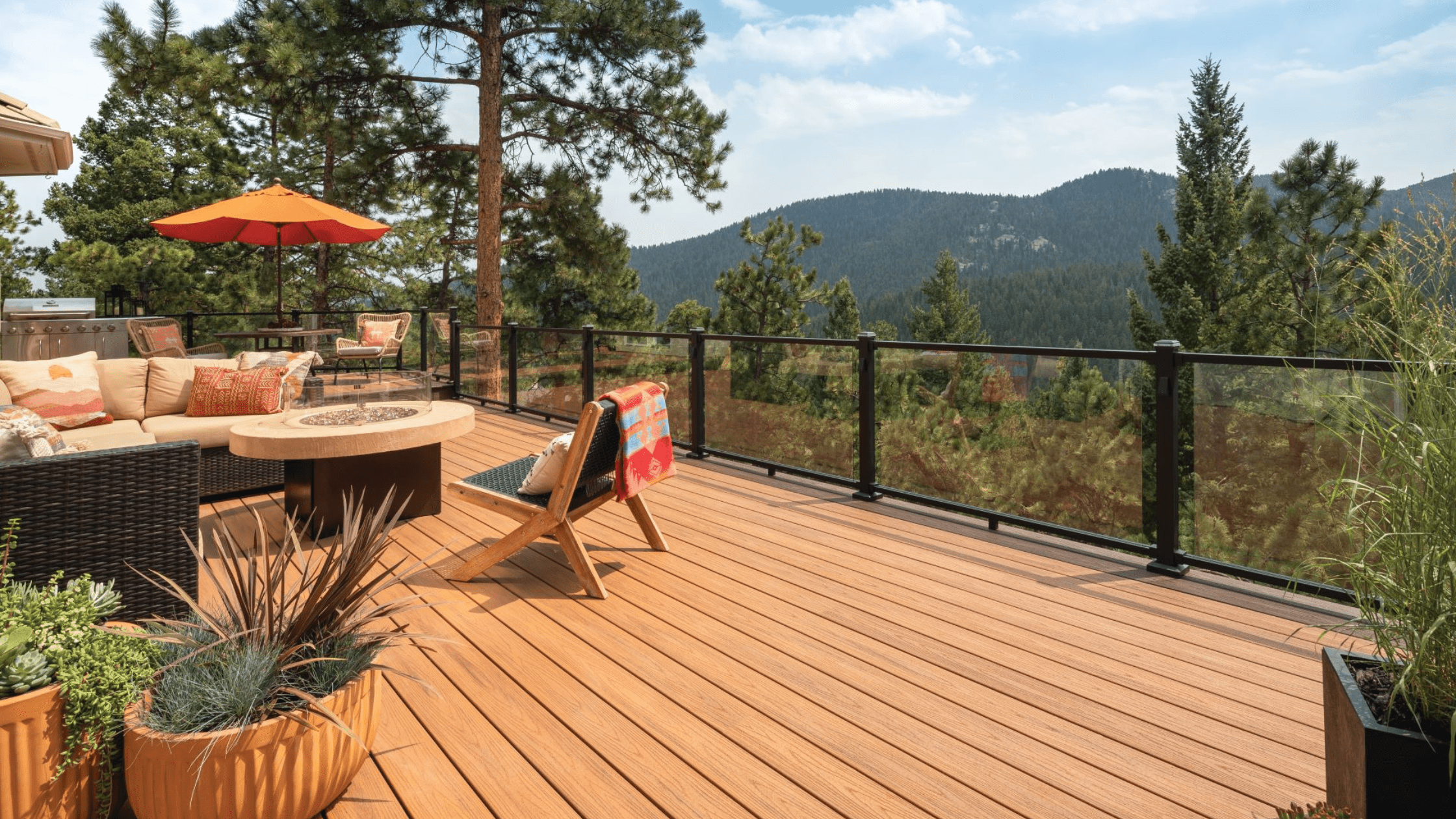 20x20 deck with composite boards, scenic mountain view, and seating area — showing how much does it cost to build a 20x20 deck.