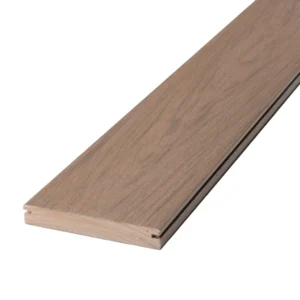 Angled view of Deckorators Vault grooved-edge deck board in Mesquite, showcasing its soft brown hue and woodgrain texture.