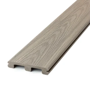 Close-up view of the Deckorators Venture grooved deck board in Saltwater, showcasing its soft coastal gray tone and realistic wood grain texture for a refined, low-maintenance finish.