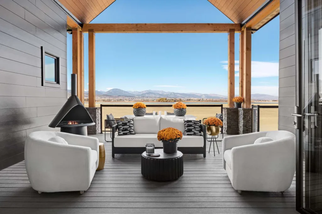 Wide shot of an outdoor entertaining space with Deckorators Vista Driftwood decking, blending coastal aesthetics with composite performance.