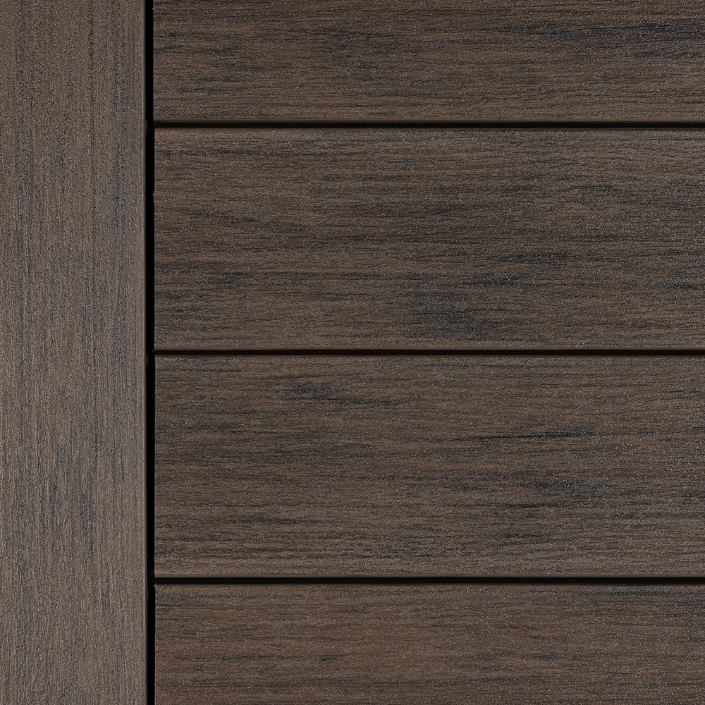 Dark, rich brown Deckorators Vista decking in Ironwood finish – features textured grain for a bold, natural wood appearance.