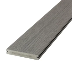 Grooved-edge Deckorators Vista Driftwood deck board in soft brown-grey tones, designed for hidden fasteners and clean lines.