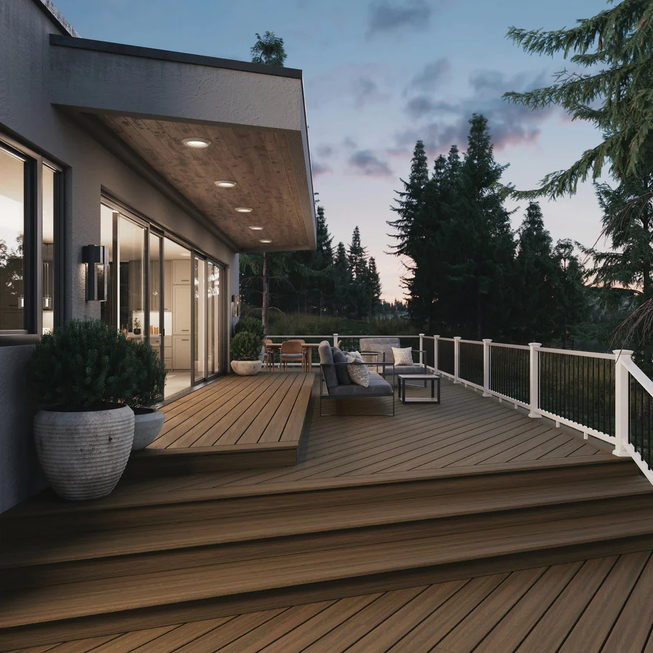 Rustic-inspired deck using Forest Brown from the ArmorGuard collection, paired with wood railings, potted plants, and earthy tones for a warm, inviting backyard retreat.