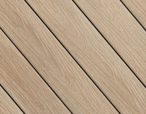 Fiberon Concordia Astir decking in Prairie Wheat, featuring a warm tan hue with rich woodgrain texture and earthy character.