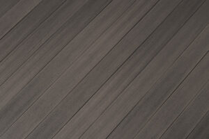 Fiberon Concordia decking in Graphite, offering a modern charcoal gray look with smooth texture and subtle tonal variation.
