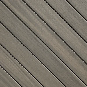 Paramount decking in Sandstone, a light golden tan color with warm undertones and realistic woodgrain styling for a clean, natural look.