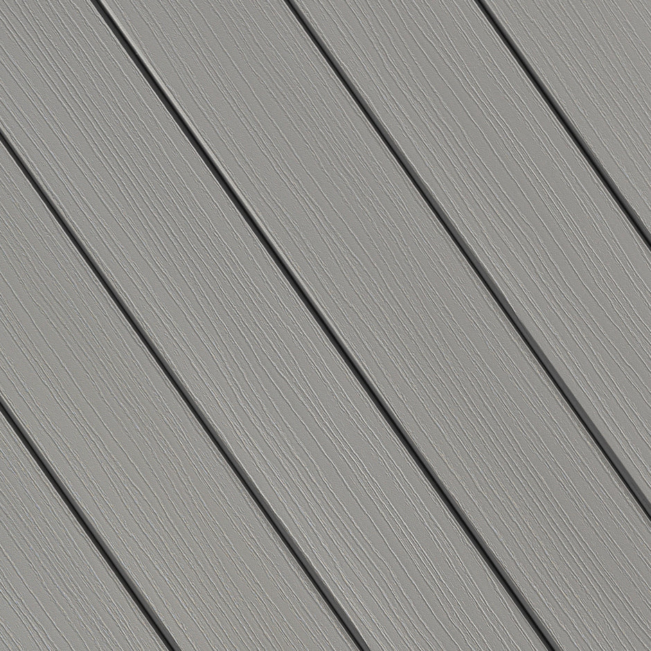 Fiberon Paramount decking in Mineral, a solid light gray PVC board with fine grain pattern, offering a sleek and versatile look for modern outdoor spaces.