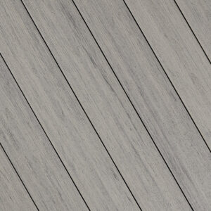 Swatch of Fiberon Sanctuary decking in Chai, a warm taupe tone with soft woodgrain embossing for a cozy, neutral look.