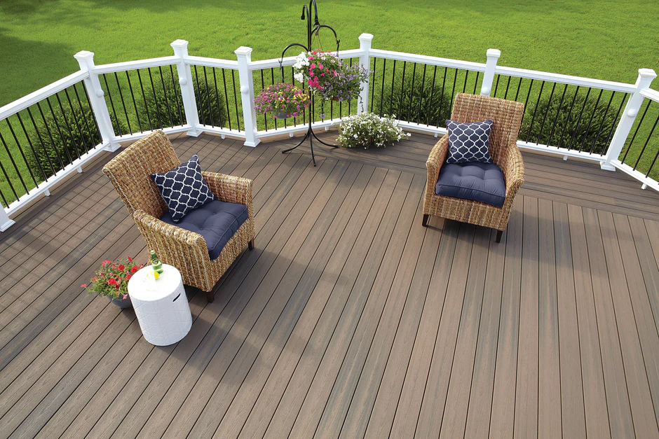 Cozy deck space using Sanctuary Latte decking, complete with white outdoor furniture and soft beige tones for a bright, welcoming feel.