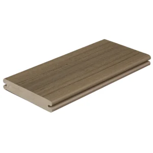 A single grooved composite deck board in Brownstone from the Fiberon Paramount collection, displayed against a white background. The board shows a warm brown tone with natural-looking grain details and subtle streaks running lengthwise.