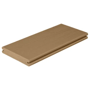 A grooved-edge composite deck board from the Fiberon Paramount Mantel Clay collection is shown on a plain white background. The board has a solid tan color with subtle woodgrain texture along the surface, offering a smooth and uniform appearance ideal for clean, modern deck designs.