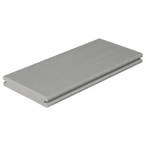 Close-up product image of Fiberon Paramount Decking in the Mineral color. The board features a smooth, cool-toned light gray surface with a subtle woodgrain texture and grooved edge profile, designed for hidden fasteners.