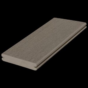 Angled product image of a single Fiberon Promenade Shaded Cay grooved deck board, revealing its muted gray surface with a fine woodgrain pattern and detailed grooved edge profile.