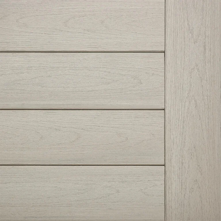 Close-up of TimberTech Landmark Collection decking in American Walnut, showcasing its rich brown tone with elegant undertones and a woodgrain texture that mimics natural hardwood.
