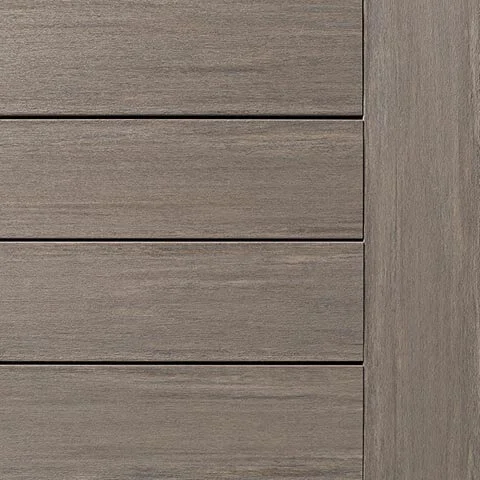 Close-up of TimberTech Vintage Coastline PVC deck board, featuring a cool, weathered gray tone with subtle woodgrain texture and a matte finish for a sleek, coastal-inspired look.