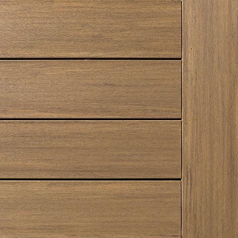 Close-up of Fiberon Promenade decking in Sandy Pier, a golden brown tone with understated streaks. Evokes the look of sunlit wood for bright, natural spaces.