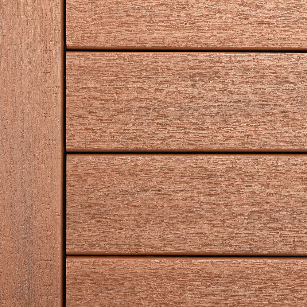 Close-up of Deckorators Summit decking in Boulder, a warm medium-brown shade with natural woodgrain texture. The low-gloss finish mimics real hardwood tones while offering a clean, contemporary look for outdoor spaces.
