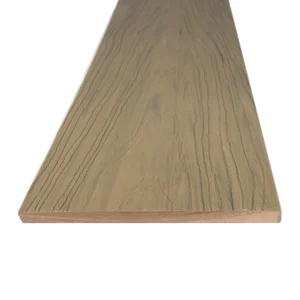 Deckorators Summit fascia board in Cliffside, shown from the edge. Features a soft tan base with realistic woodgrain detailing—perfect for finishing vertical deck elements with a clean, coordinated look.