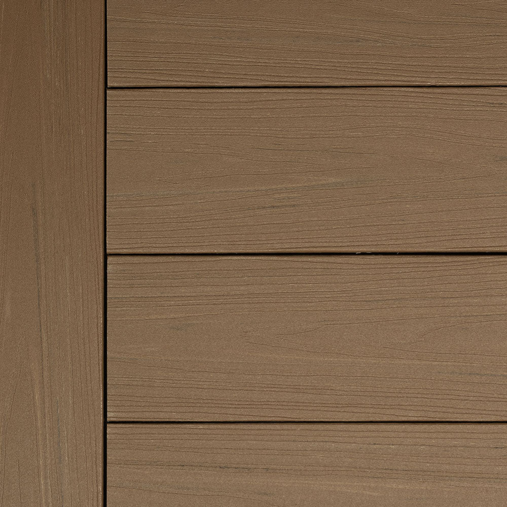 Close-up of Deckorators Summit decking in Boulder, a warm medium-brown shade with natural woodgrain texture. The low-gloss finish mimics real hardwood tones while offering a clean, contemporary look for outdoor spaces.