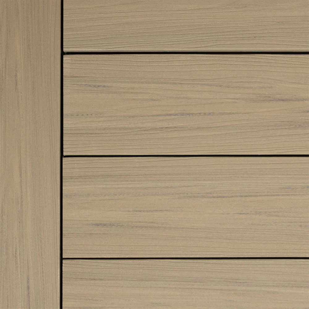 Summit decking in Cliffside, a sleek, gray-toned board with subtle streaking and realistic grain lines. This mineral-based composite option offers a clean, coastal-inspired aesthetic with durable, low-maintenance performance.