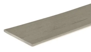 Close-up product shot of the TimberTech Terrain+ Weathered Oak composite fascia board, showcasing a straight, square-edged profile with a subtle wood grain texture and cool-toned gray color.