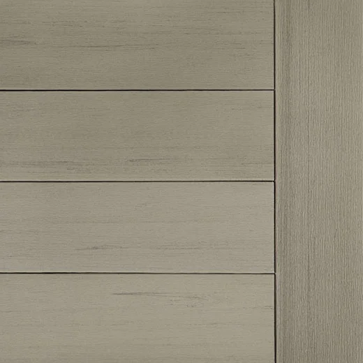 TimberTech Terrain+ swatch in Weathered Oak, highlighting a cool-toned grayish wood aesthetic with gentle grain embossing. The decking boards are shown in horizontal alignment with a vertical edge board to the right. The matte finish creates a worn, sun-faded oak appearance perfect for neutral, rustic settings.