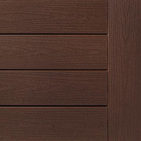 Close-up of TimberTech Terrain+ decking in Natural White Oak, featuring a soft, creamy hue with realistic wood grain detailing. The image displays smooth, horizontally laid boards with a single vertical edge board on the side. The finish offers a light and airy hardwood look ideal for modern outdoor spaces.