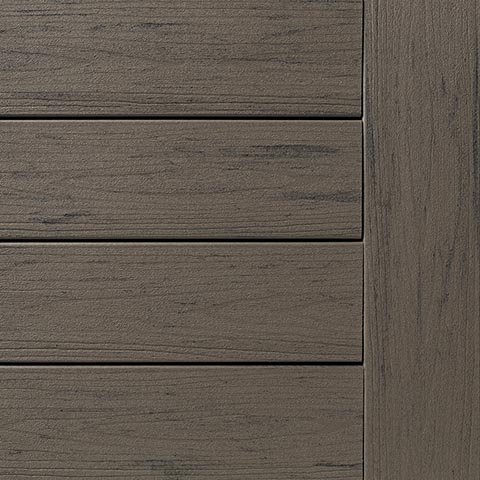 Detailed view of TimberTech Terrain+ Silver Maple decking swatch in a mid-tone greige color with wood-like streaking and low-sheen finish. A versatile option for modern or transitional outdoor spaces.