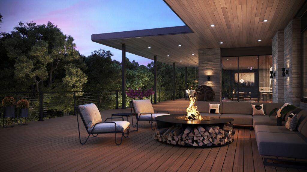 Outdoor fire pit lounge area with Trex Signature Ocracoke decking under evening lighting.