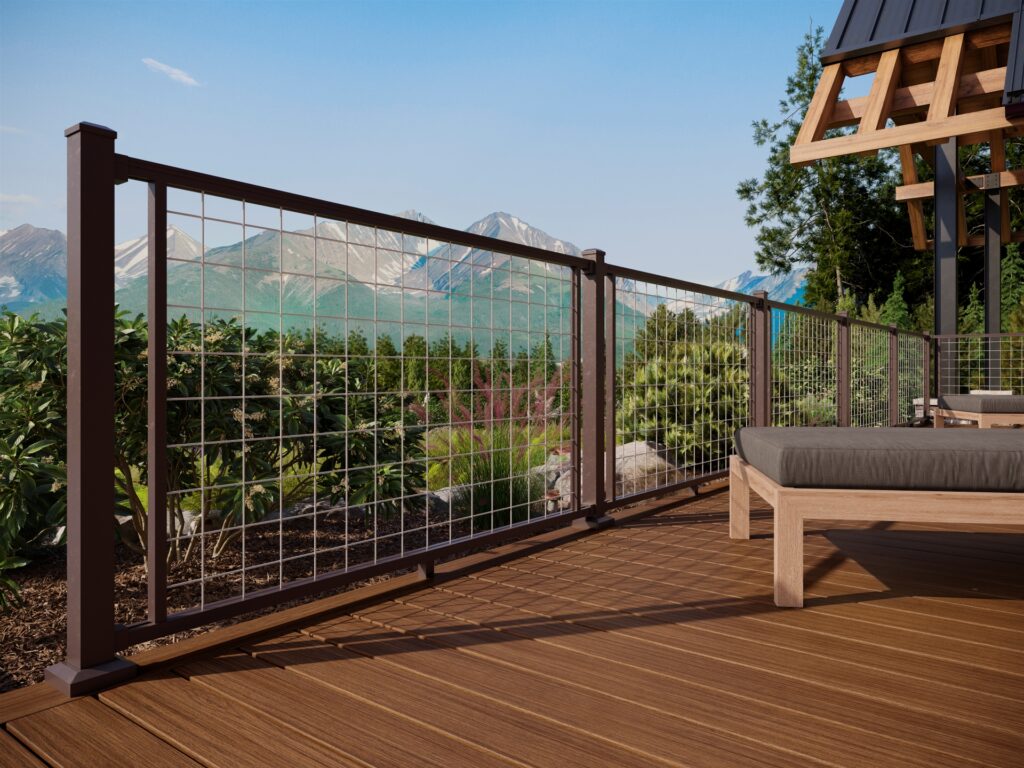 Close-up of Trex Signature Ocracoke decking with metal railing and scenic mountain backdrop.