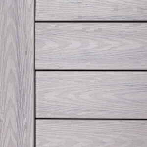 Close-up of Deckorators Altitude Trailstone decking in a soft cool gray tone with refined woodgrain texture.
