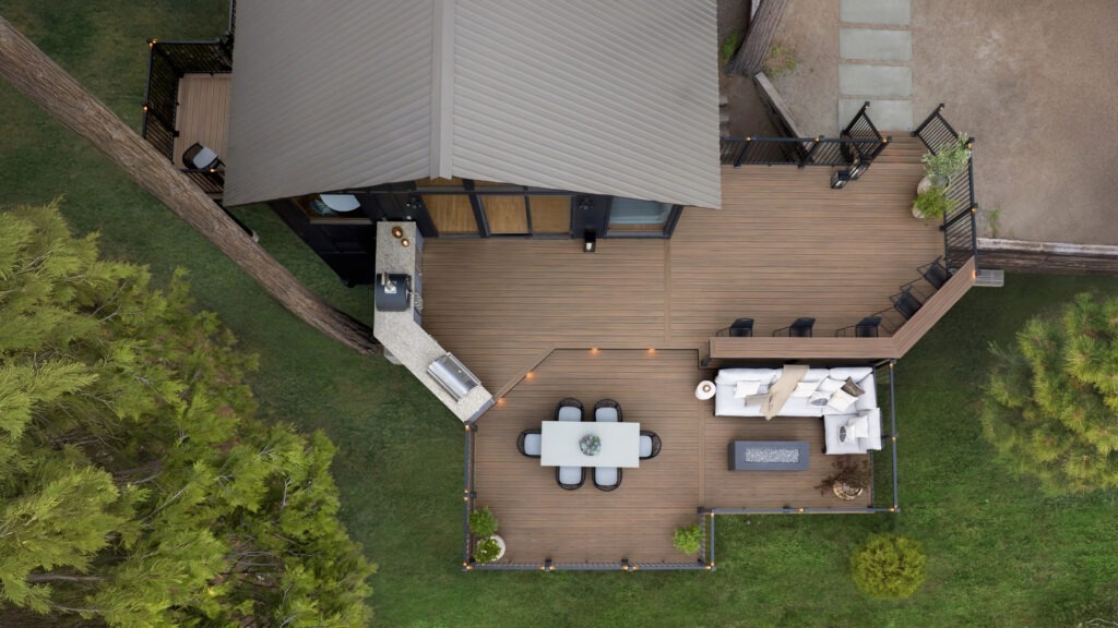 Aerial view of multi-level TimberTech deck with outdoor kitchen and seating areas.