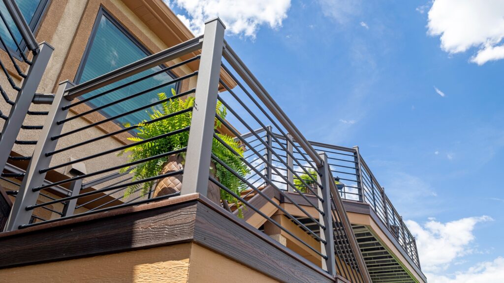 Black aluminum horizontal deck railing with modern powder-coated finish and clean lines.