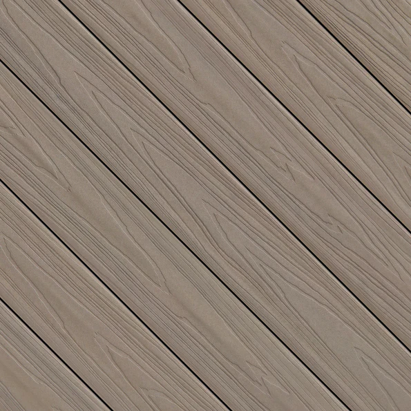 A close-up view of Fiberon ArmorGuard decking in Aspen Gray, showing soft taupe-gray planks with subtle woodgrain texture running diagonally across the frame. The surface displays gentle tonal variation that mimics natural stained wood.