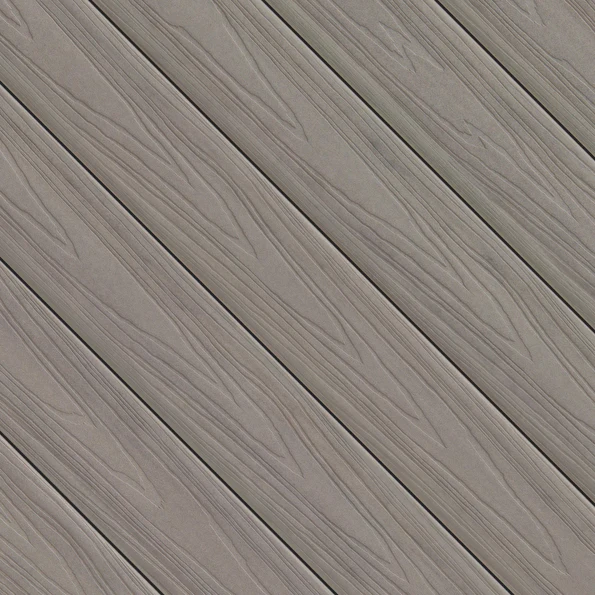 A detailed swatch of Fiberon ArmorGuard decking in Coastal Gray, featuring cool gray tones with realistic woodgrain patterns. The diagonally arranged planks highlight the smooth matte finish and natural-looking grain detail.