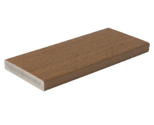 Fiberon Concordia Symmetry Warm Sienna square-edge decking board displayed individually, showcasing its golden-brown color, woodgrain detail, and smooth capped composite surface ideal for borders and stair edges.