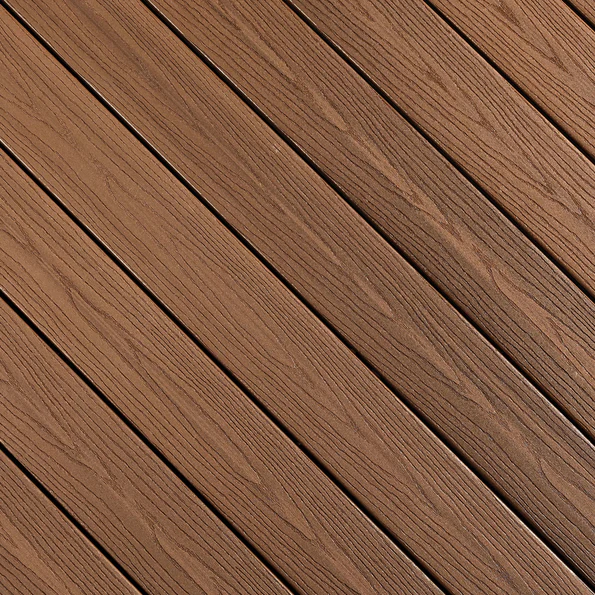 This swatch features Fiberon Good Life Bungalow, a warm medium-brown decking shade with soft, natural woodgrain lines across each diagonal plank. The surface includes subtle tonal variation, mimicking the depth of lightly aged hardwood. The color has a welcoming, earthy feel ideal for casual outdoor settings.