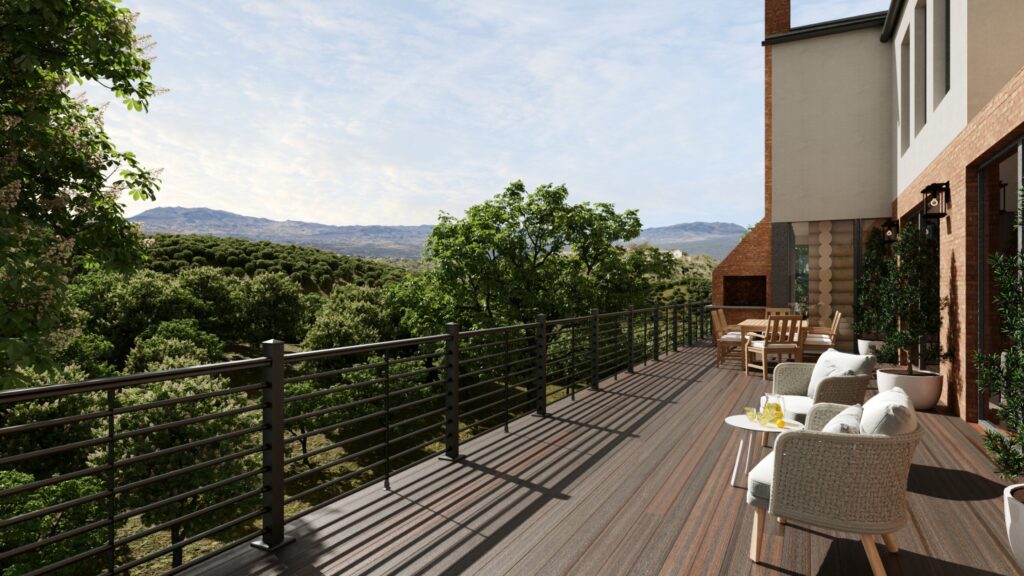 Hillside modern home deck with black aluminum horizontal railing and scenic valley view.