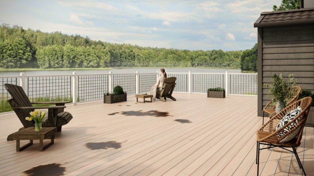 Light Envision composite deck with spill stains showing how to clean Envision decking and remove grease or oil.