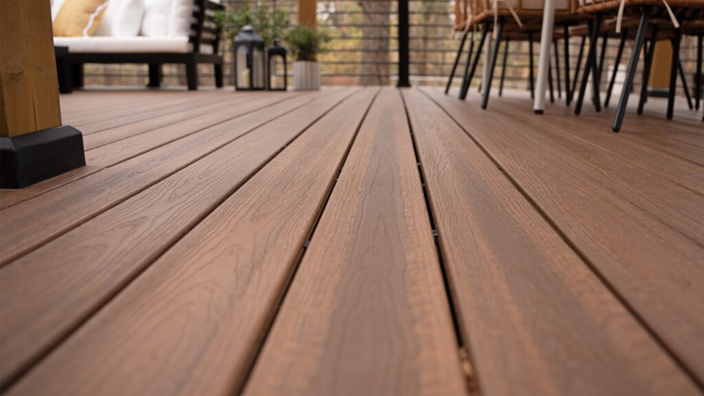 Footprint stains and residue on gray Envision deck highlighting common cleaning mistakes.