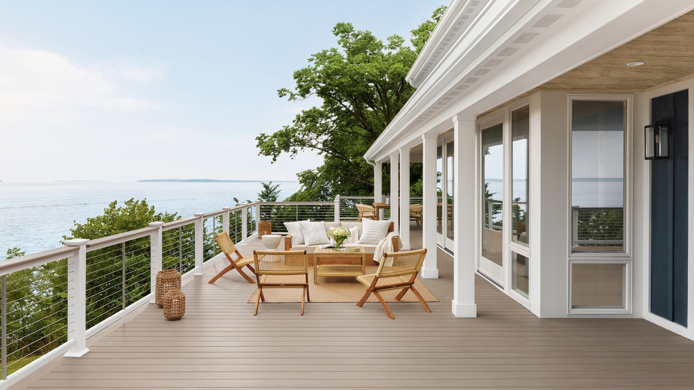 Luxury backyard deck with TimberTech composite boards around a pool, highlighting deck cost based on premium materials