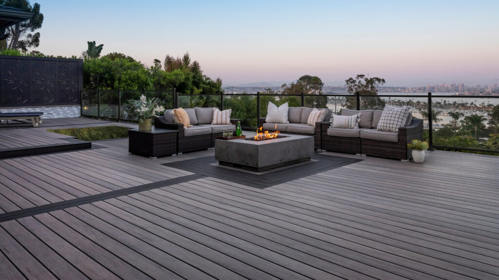 TimberTech Legacy Espresso deck with sleek modern top rail and cushioned lounge seating.